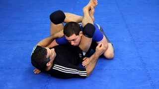 How to Do the Triangle Choke  MMA Fighting [upl. by Atsirc]