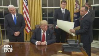 Watch President Trumps first signings in Oval Office [upl. by Yentruocal]